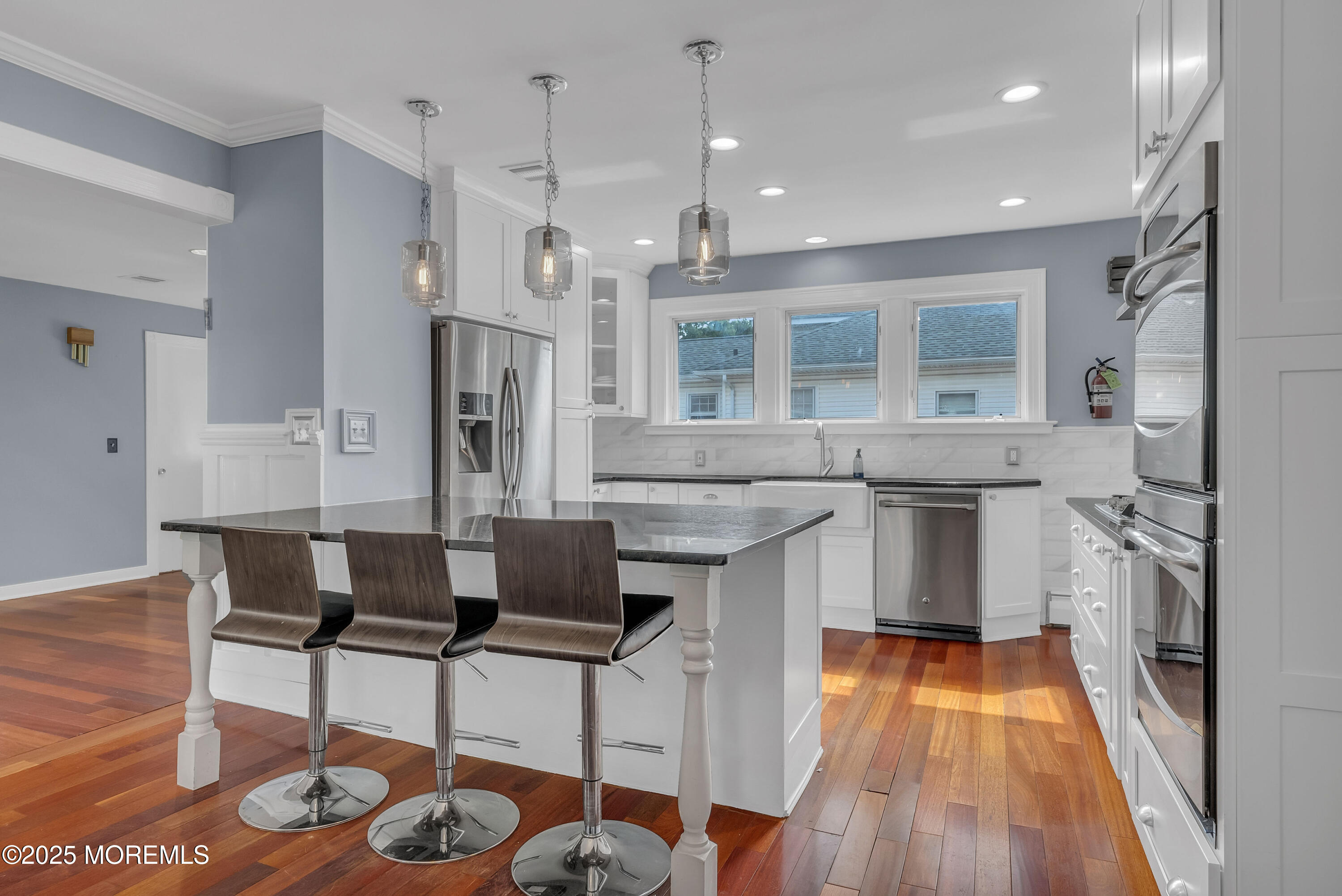 308 Monmouth Road West Long Branch, NJ 07764 - Photo 11 of 32 a kitchen with stainless steel appliances kitchen island granite countertop a sink and cabinets