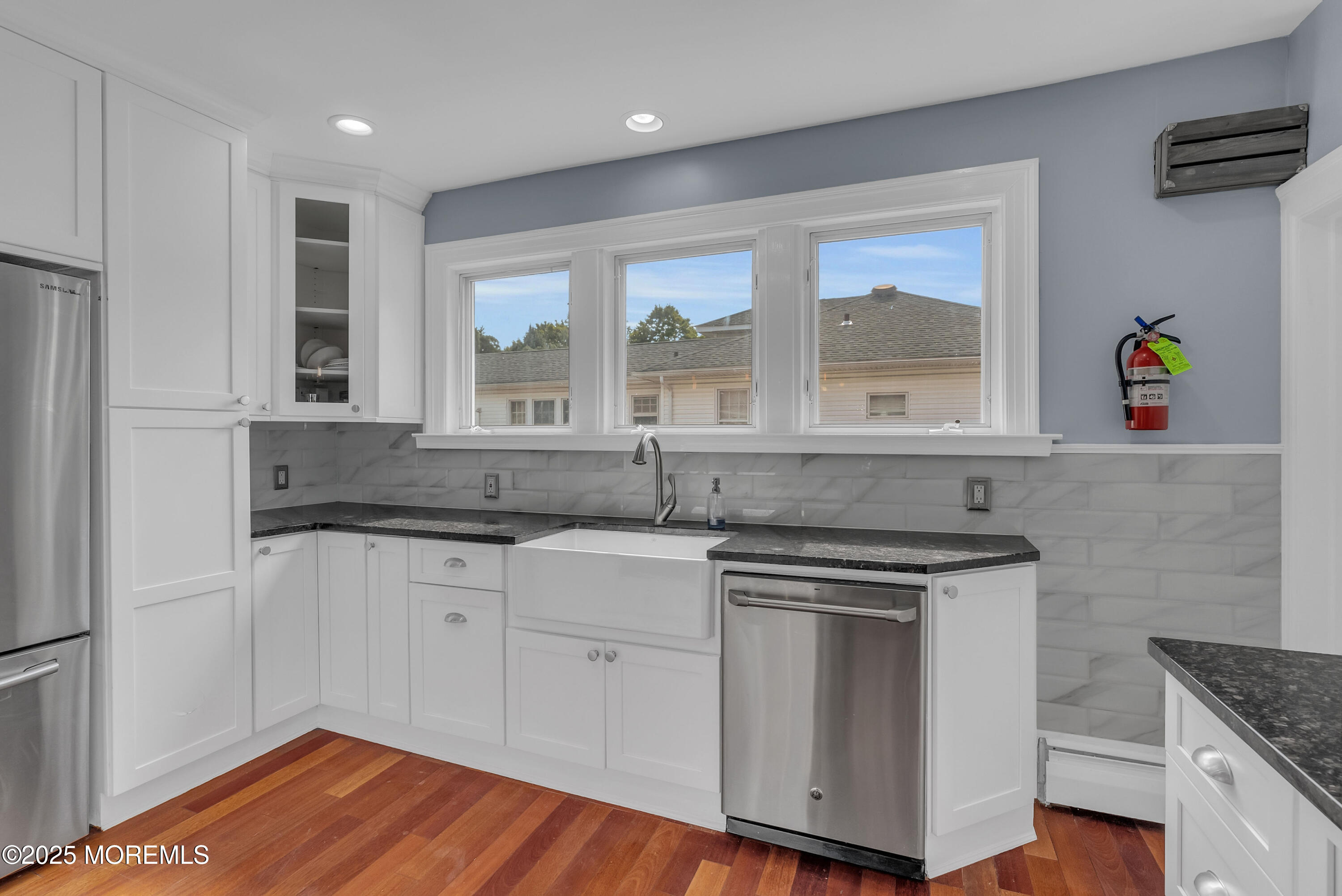 308 Monmouth Road West Long Branch, NJ 07764 - Photo 12 of 32 a kitchen with granite countertop a stove and a sink