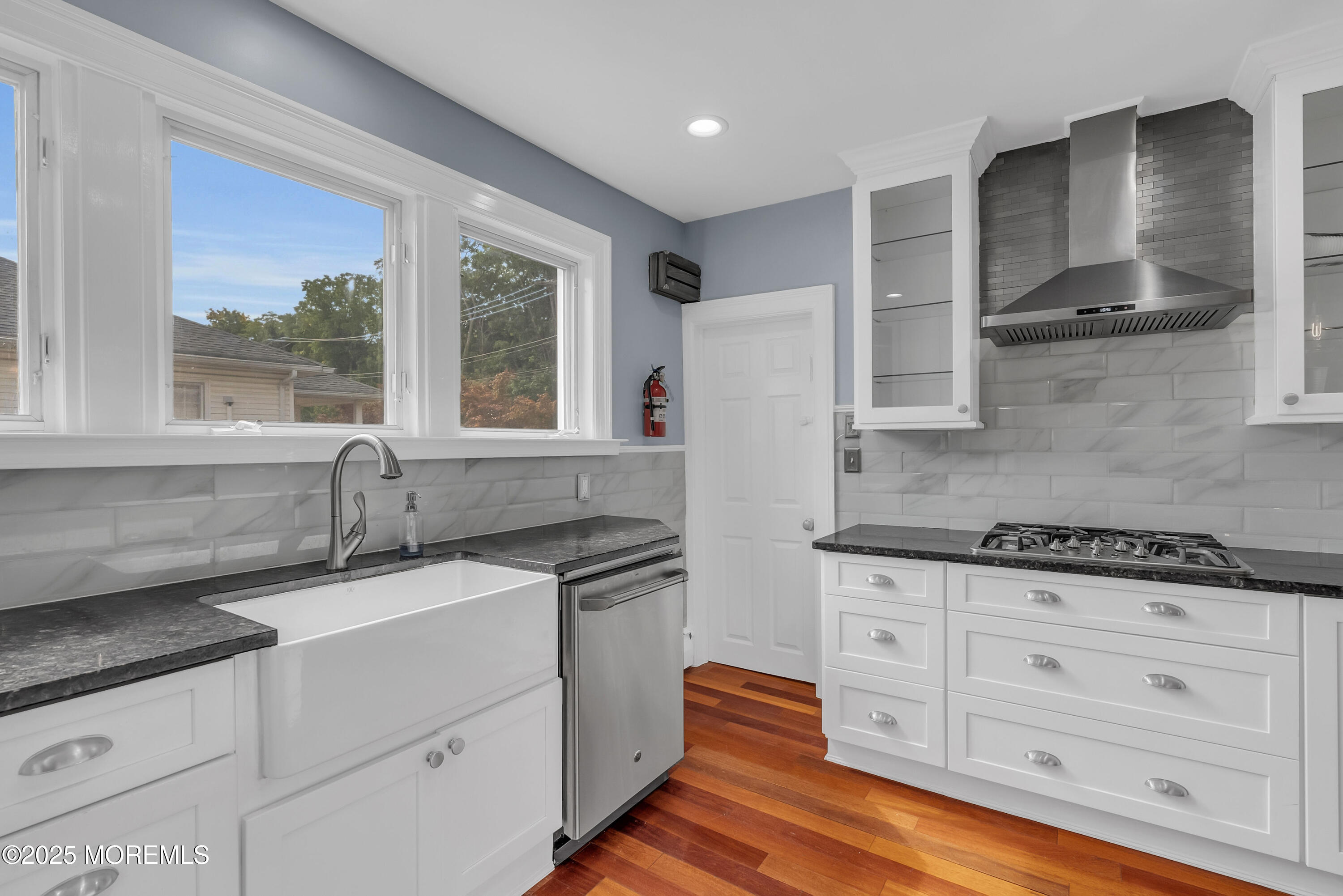 308 Monmouth Road West Long Branch, NJ 07764 - Photo 15 of 32 a kitchen with granite countertop a sink stainless steel appliances and cabinets