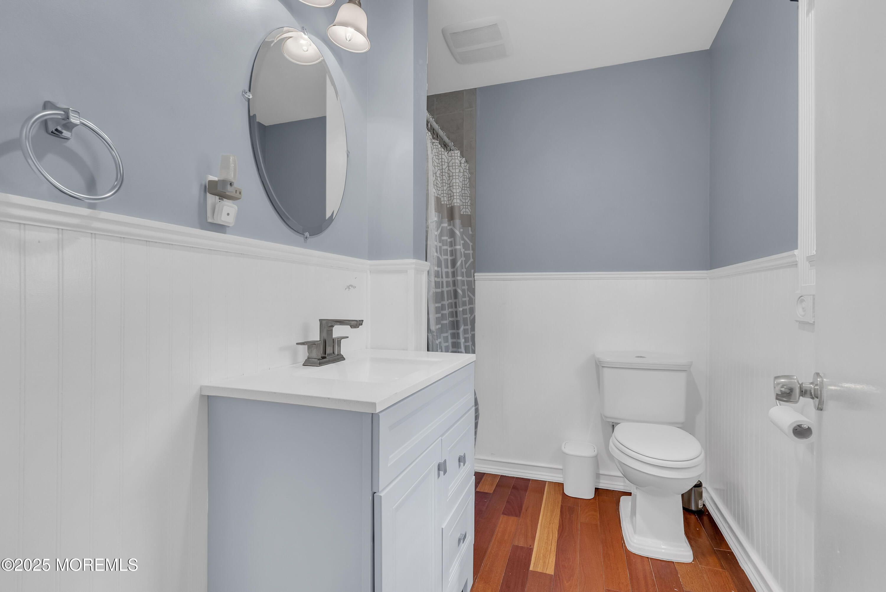 308 Monmouth Road West Long Branch, NJ 07764 - Photo 18 of 32 a bathroom with a sink a toilet and a mirror