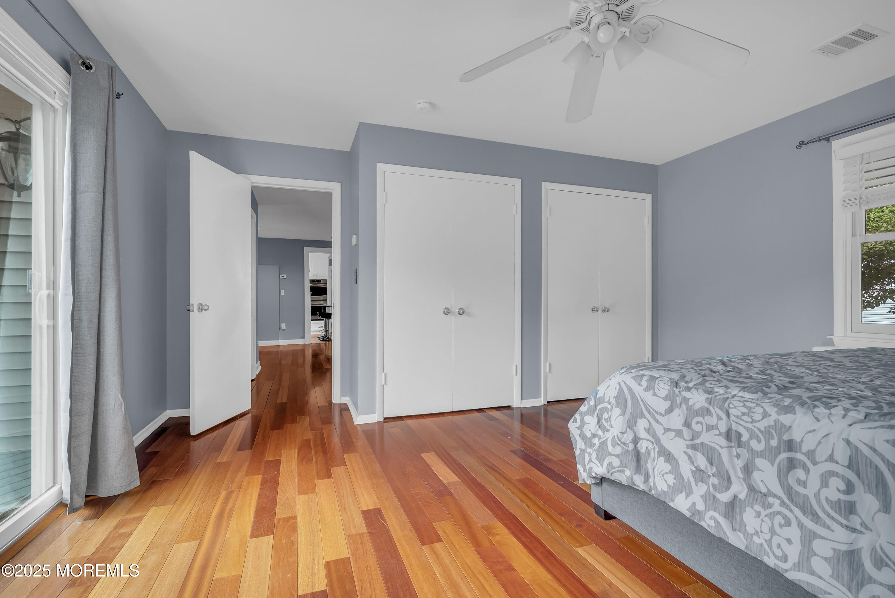 308 Monmouth Road West Long Branch, NJ 07764 - Photo 20 of 32 a bedroom with a bed and wooden floor