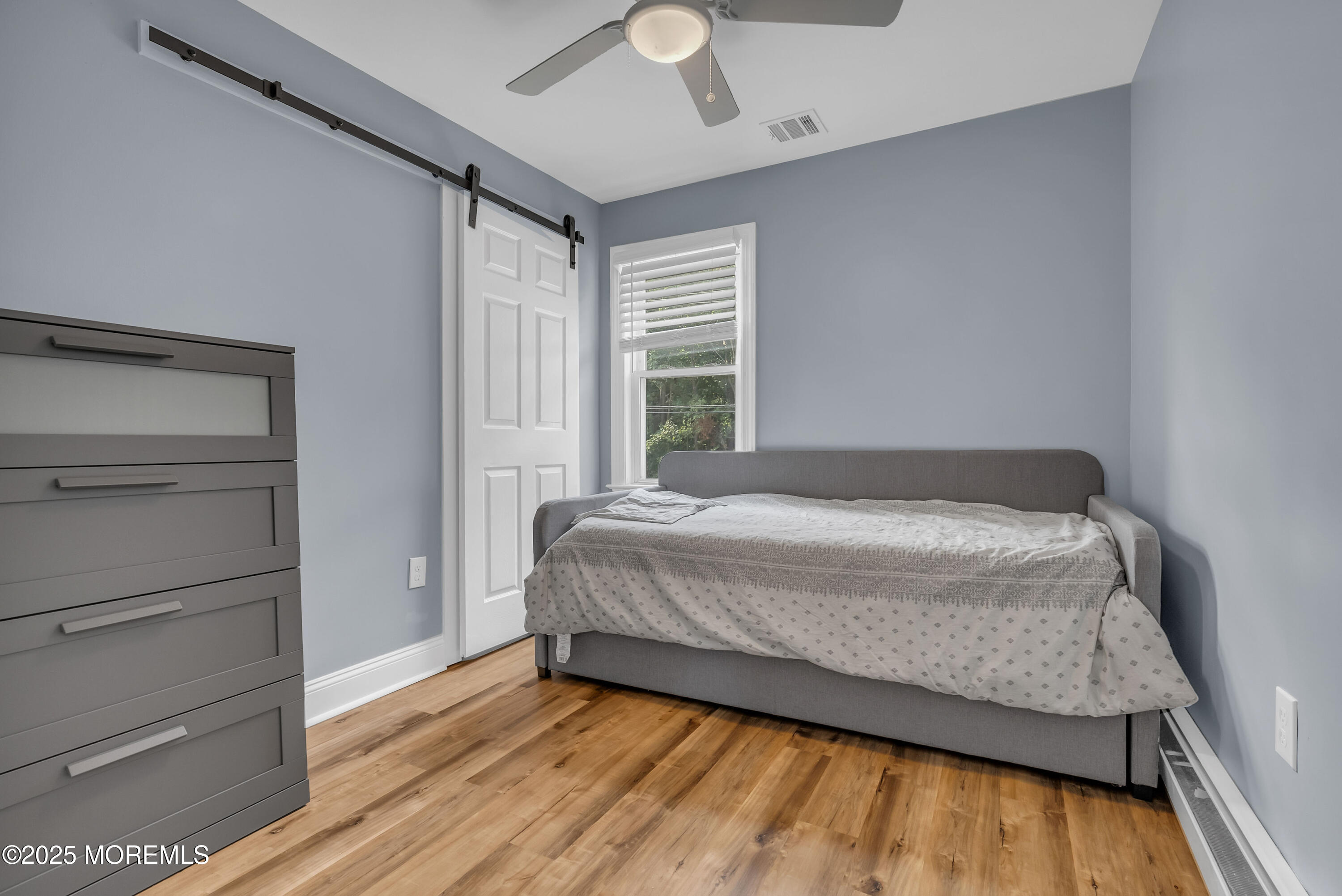 308 Monmouth Road West Long Branch, NJ 07764 - Photo 23 of 32 a bed sitting in a spacious bedroom next to a window