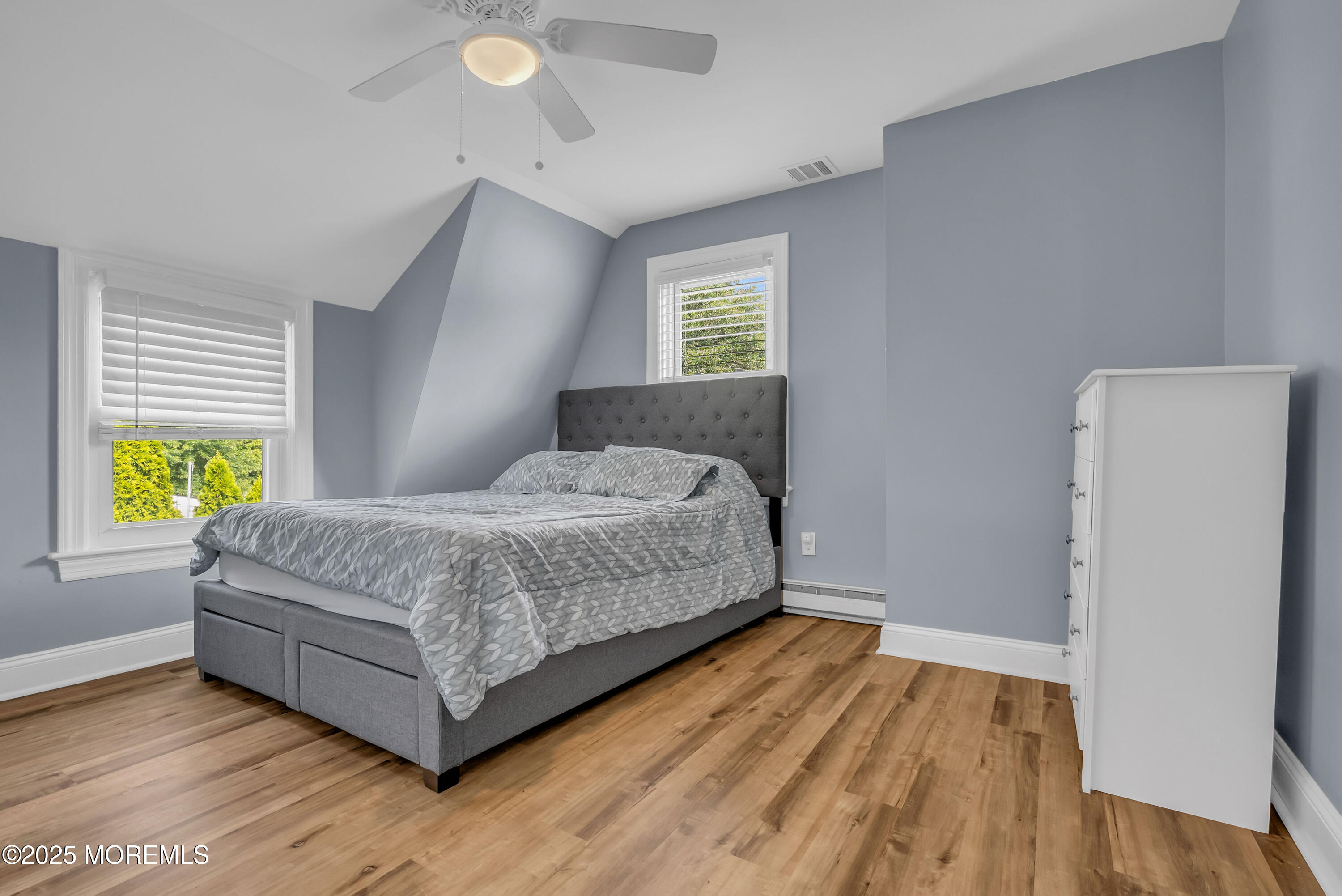 308 Monmouth Road West Long Branch, NJ 07764 - Photo 25 of 32 a bedroom with a bed and wooden floor