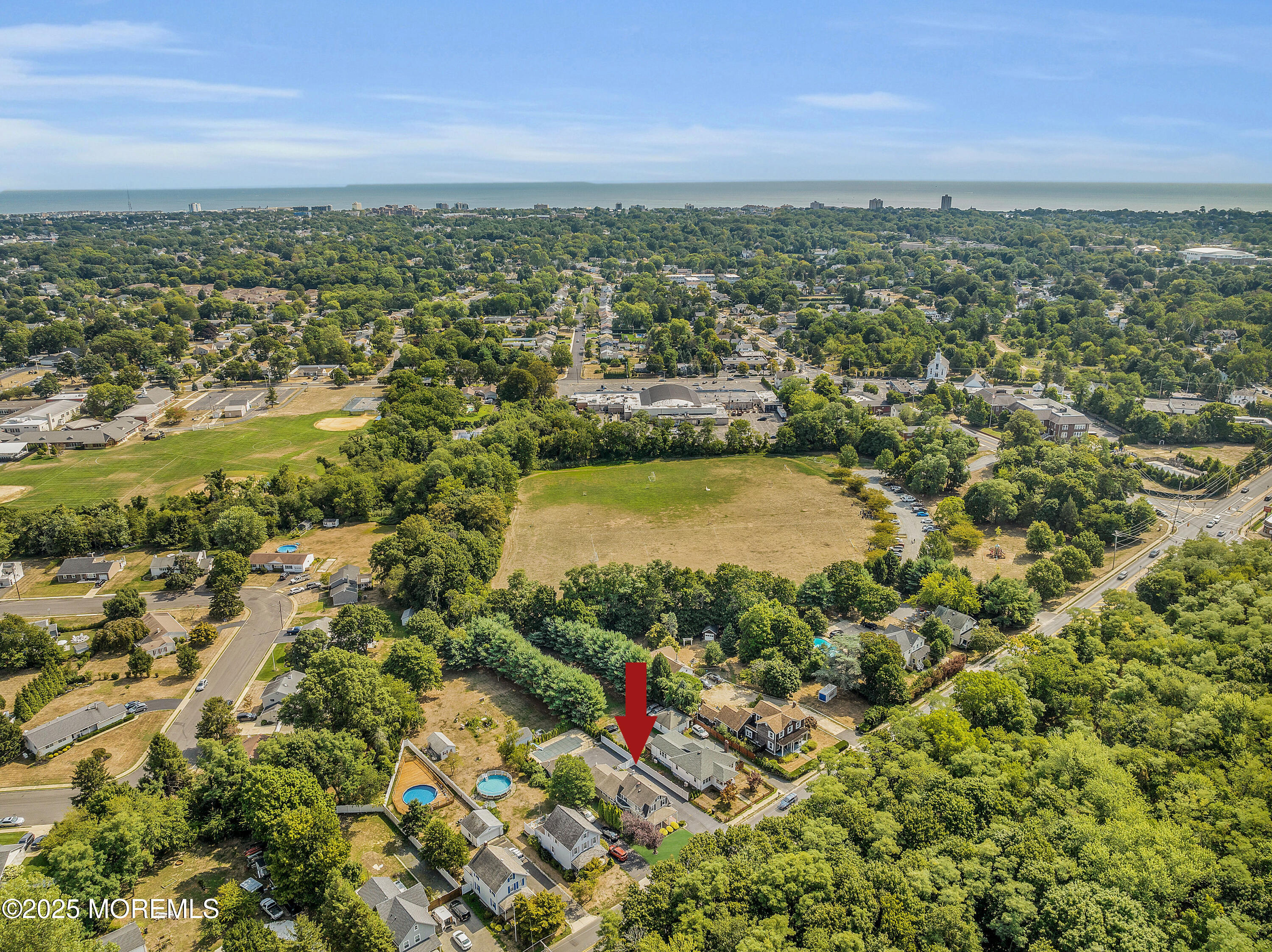 308 Monmouth Road West Long Branch, NJ 07764 - Photo 27 of 32 an aerial view of residential houses with outdoor space and trees