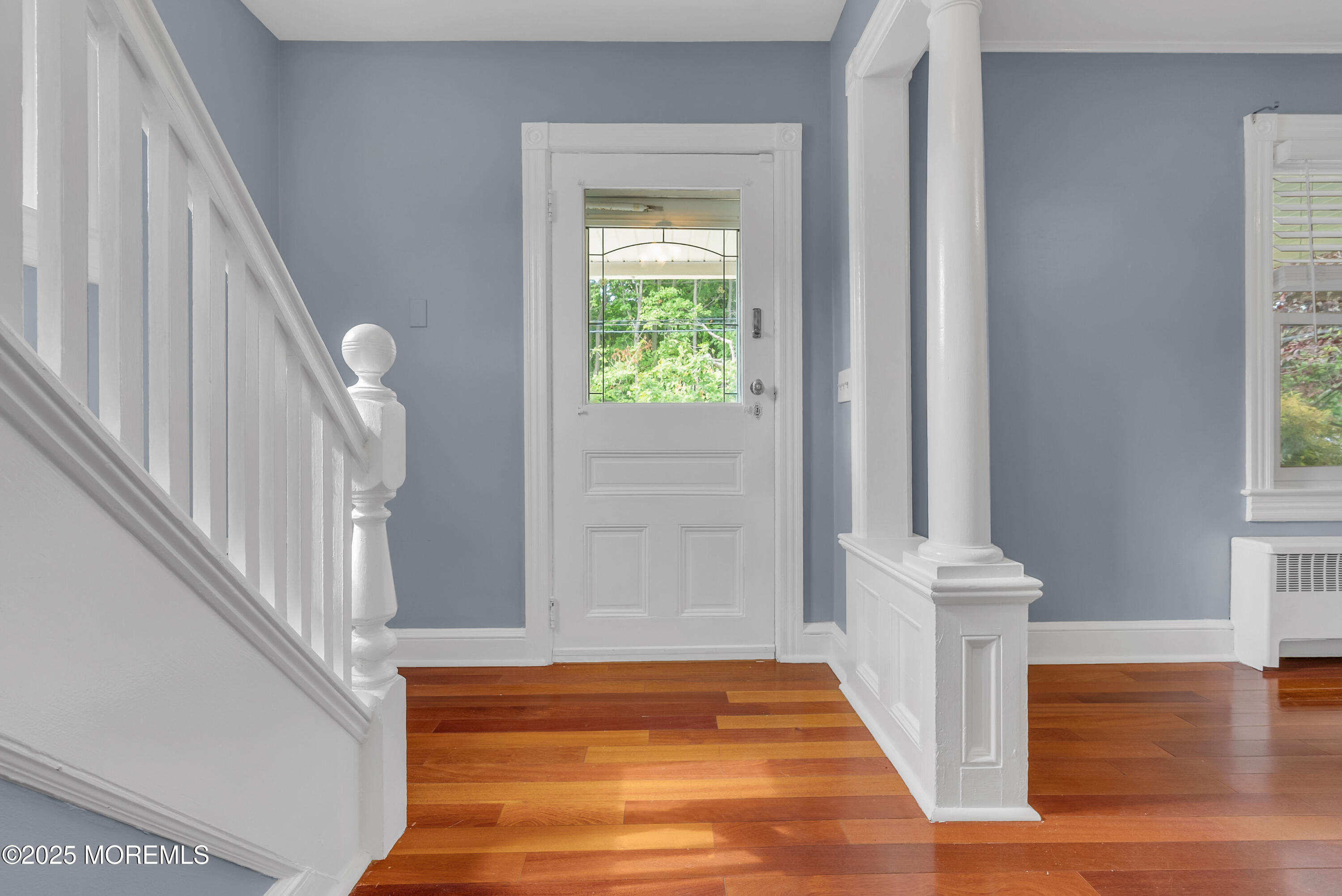 308 Monmouth Road West Long Branch, NJ 07764 - Photo 6 of 32 a view of front door with hallway and wooden floor
