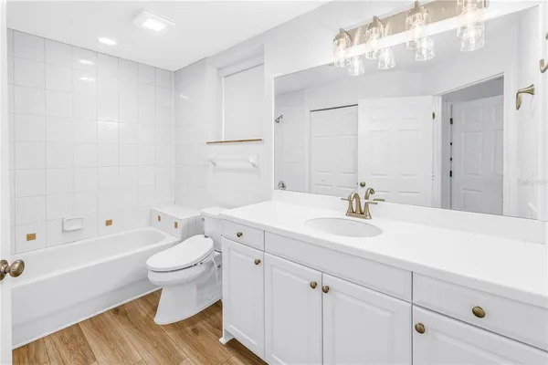 a bathroom with a sink toilet a shower and a mirror