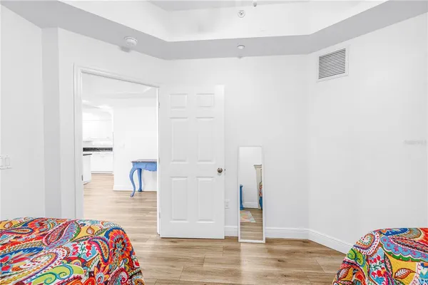 a bedroom with a bed and a table in it