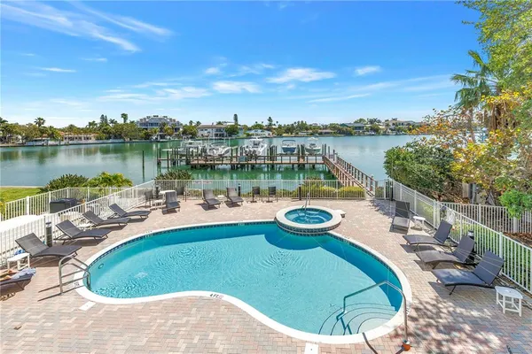 a view of a swimming pool and lounge chair