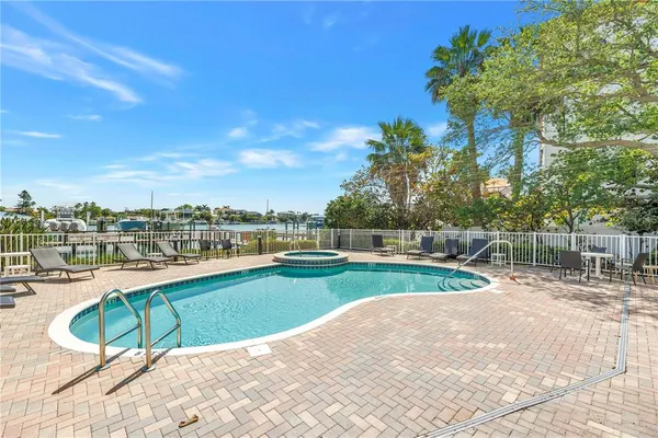 a view of a swimming pool with a lounge chair