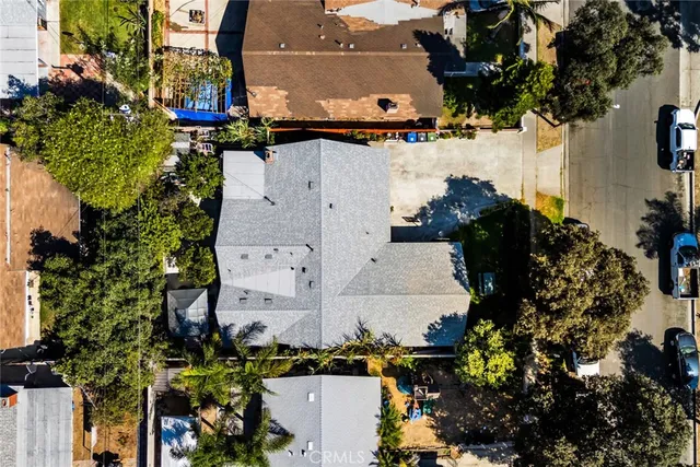 an aerial view of multiple houses with yard