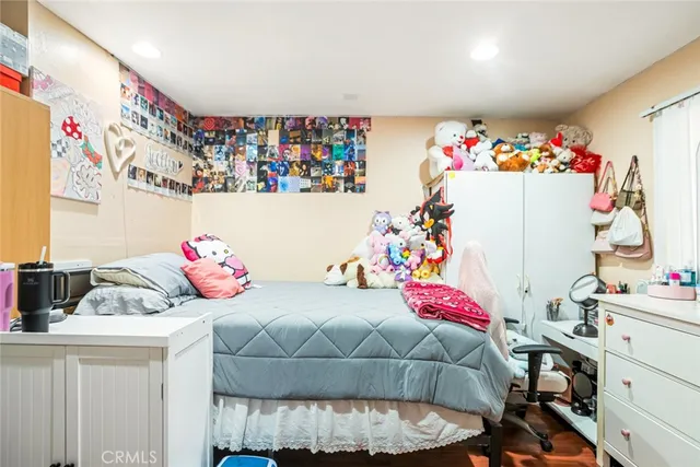 a bedroom with a bed and a dresser