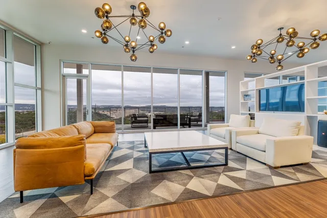 a living room with furniture and a large window