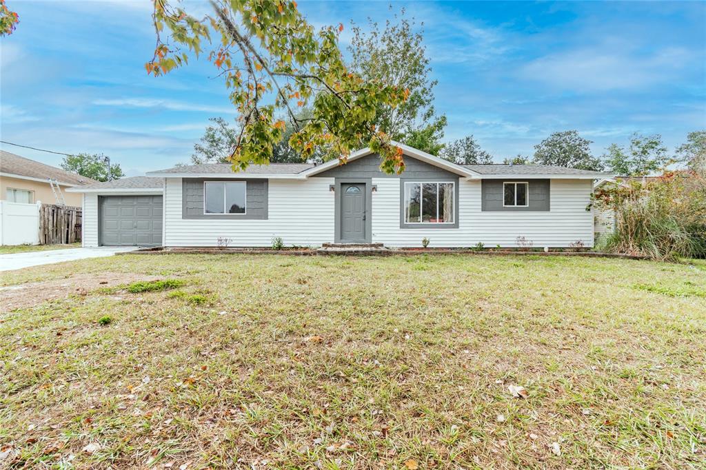 13426 Tyringham Street Spring Hill, FL 34609 - Photo 1 of 1 a house with a garden