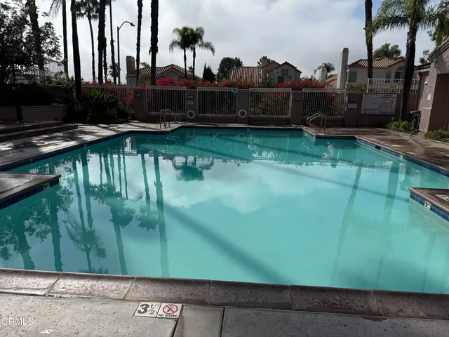 a front view of a house with a yard table and chairs