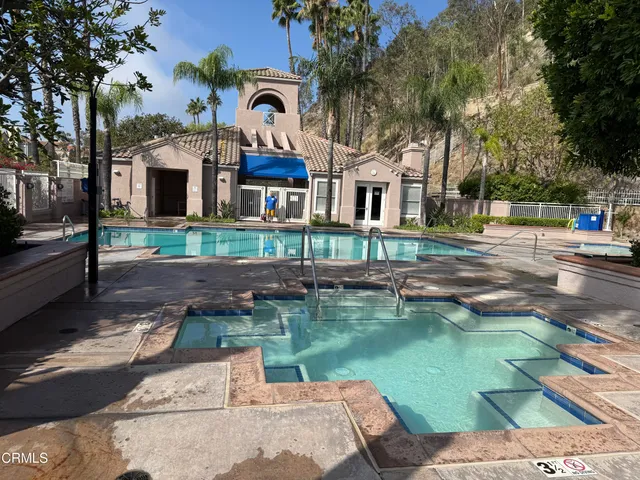 a backyard of a house with lots of green space and lake view