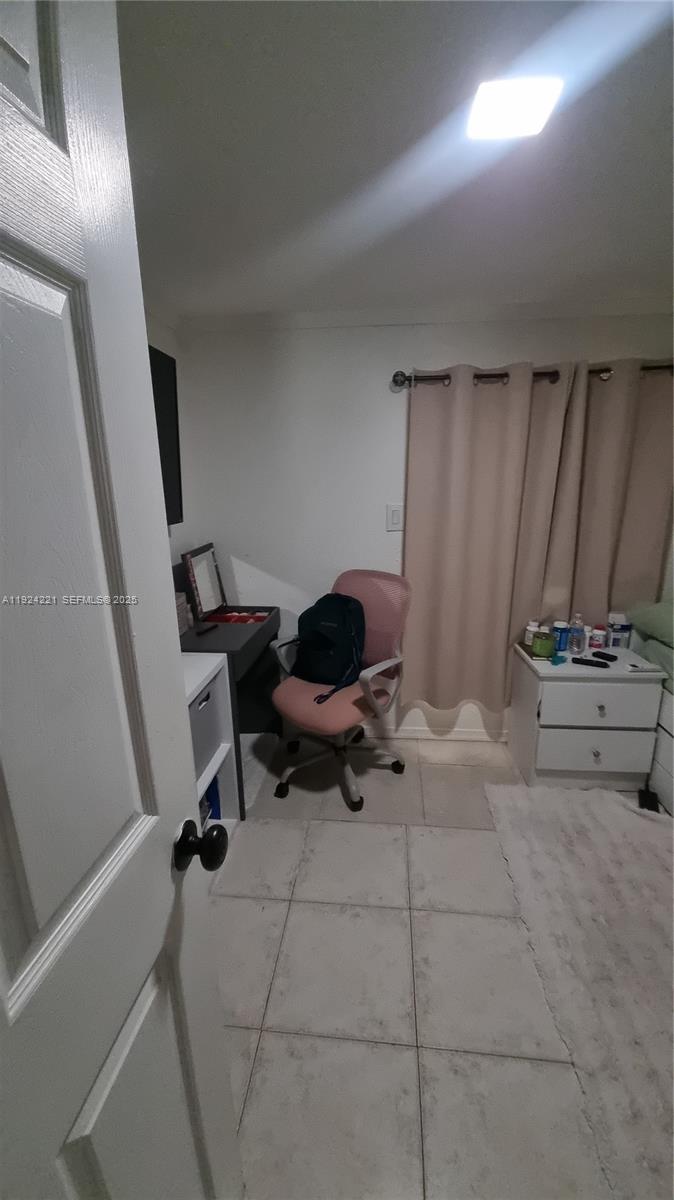 3170 Southwest 8th Street Miami, FL 33135 - Photo 15 of 33 a living room with furniture and a gate