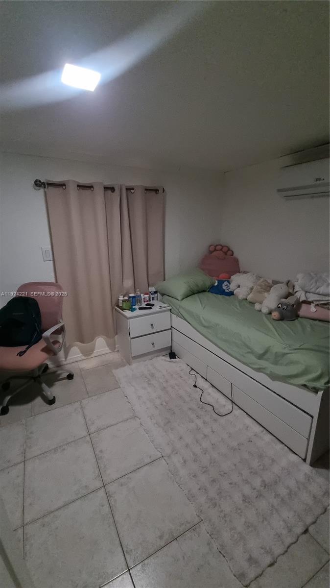 3170 Southwest 8th Street Miami, FL 33135 - Photo 16 of 33 a view of room with air conditioner duct and materials on desk