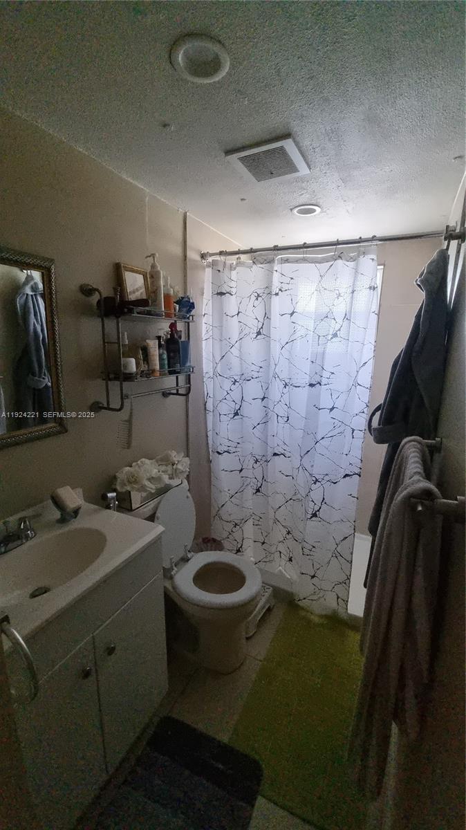 3170 Southwest 8th Street Miami, FL 33135 - Photo 23 of 33 a bathroom with a sink and a shower