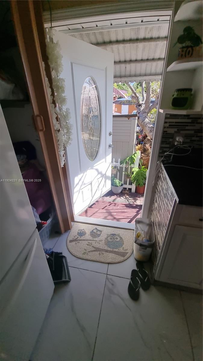 3170 Southwest 8th Street Miami, FL 33135 - Photo 25 of 33 a room with furniture and a fireplace