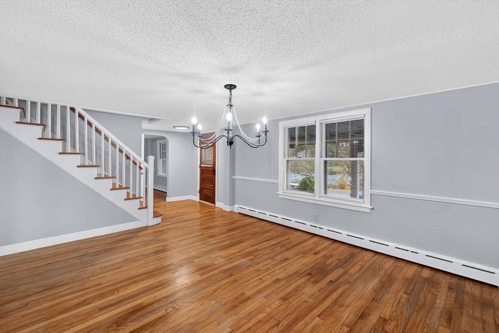4 Leonard Road Stafford, CT 06076 - Photo 12 of 37 a view of an empty room with wooden floor and a window