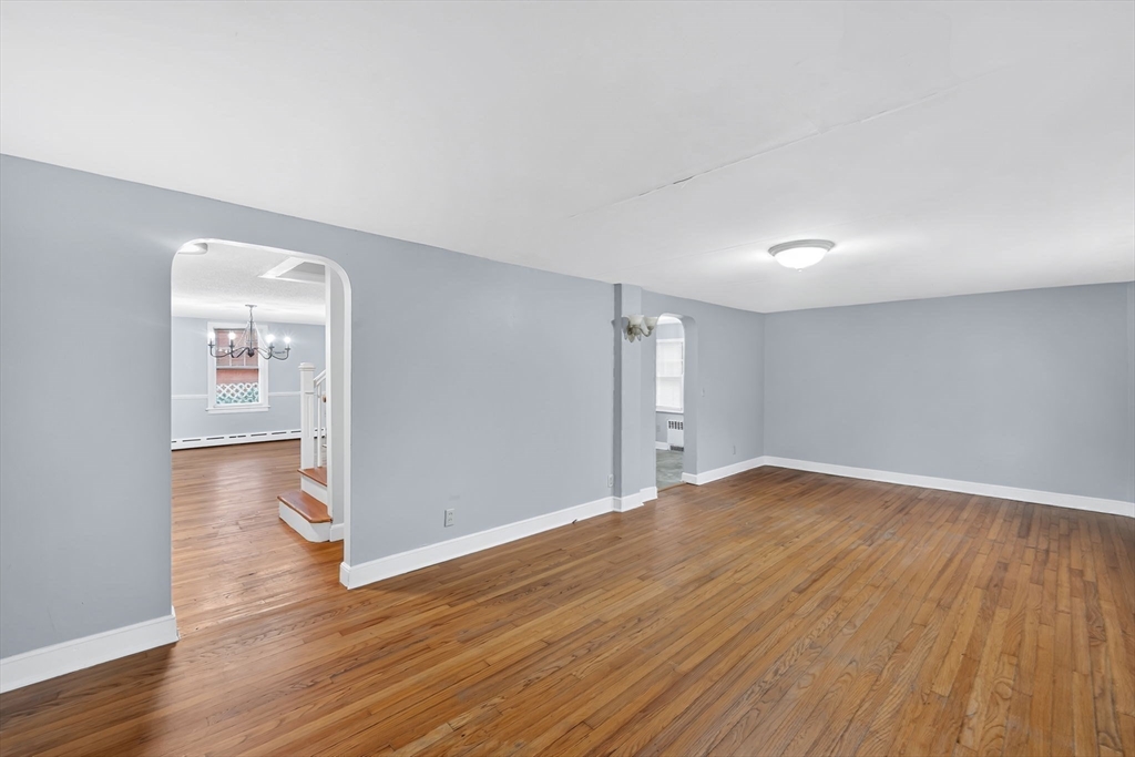 4 Leonard Road Stafford, CT 06076 - Photo 15 of 37 a view of an empty room with wooden floor and a window