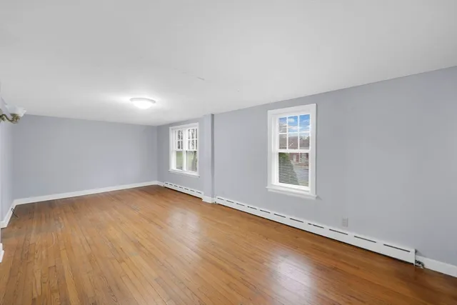 a view of backyard of house with green space