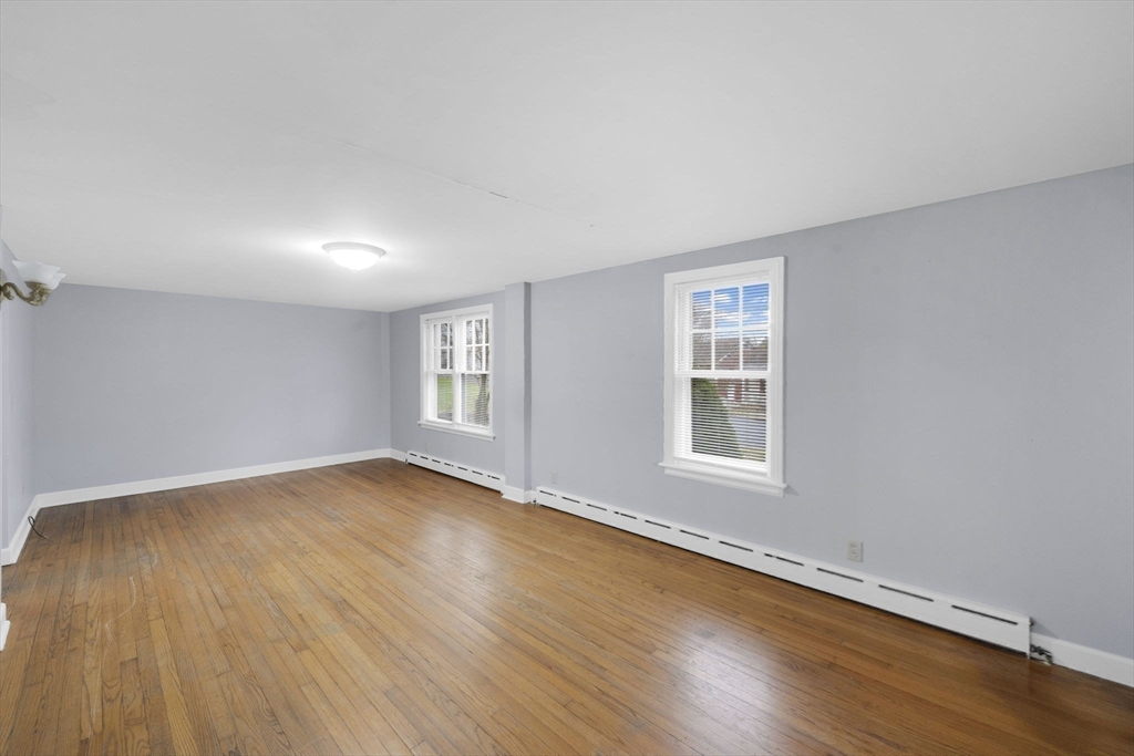4 Leonard Road Stafford, CT 06076 - Photo 16 of 37 an empty room with wooden floor and windows