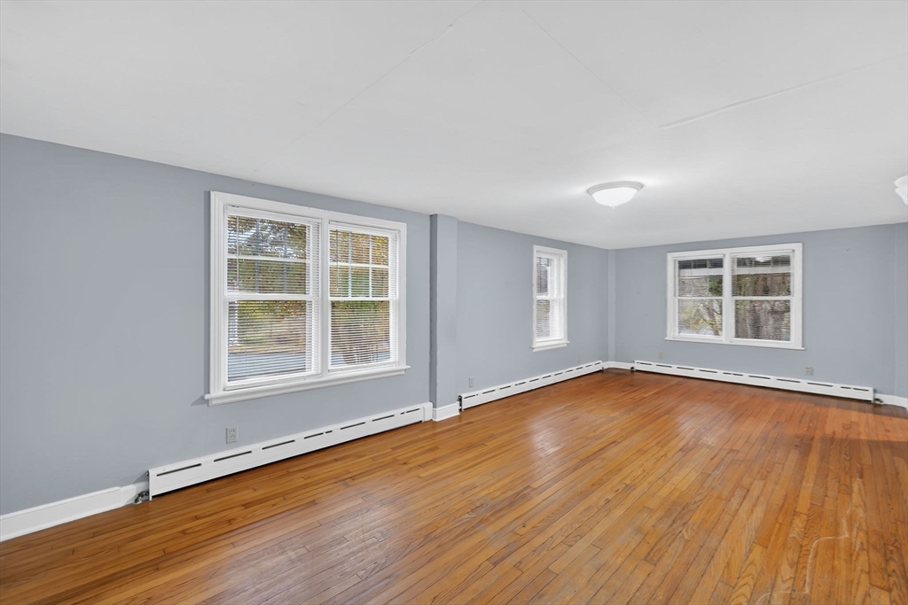 4 Leonard Road Stafford, CT 06076 - Photo 17 of 37 an empty room with wooden floor and windows