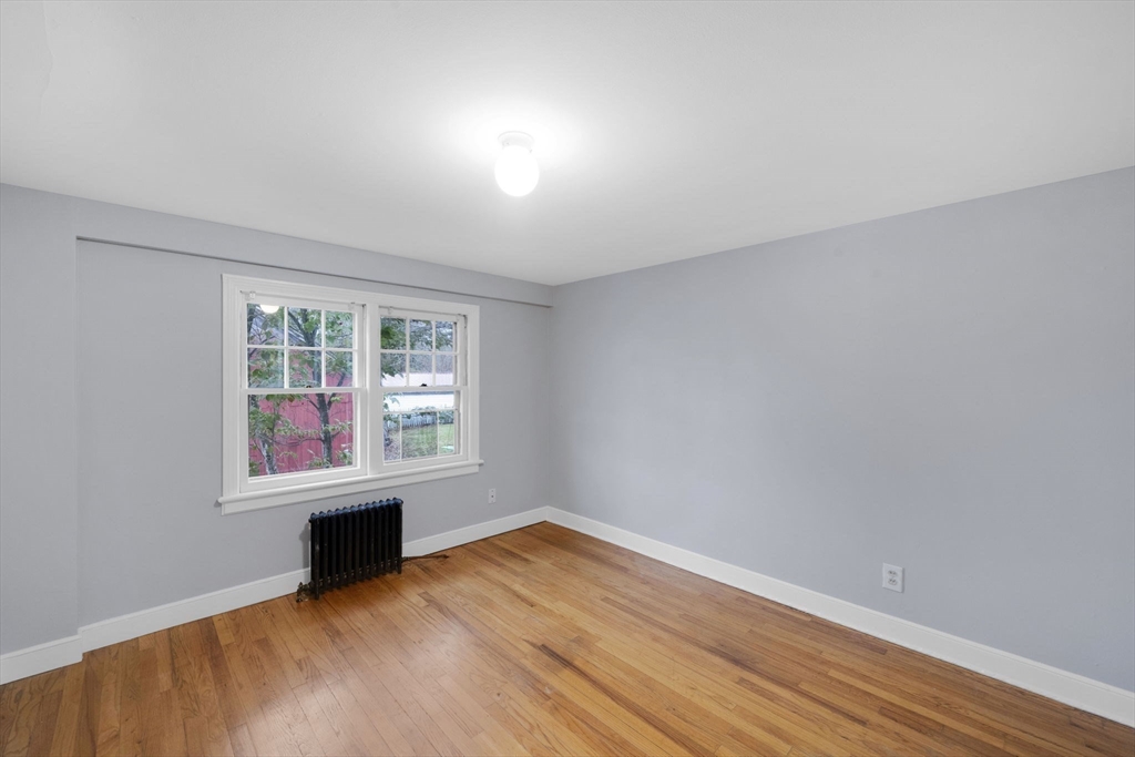 4 Leonard Road Stafford, CT 06076 - Photo 21 of 37 an empty room with wooden floor and windows