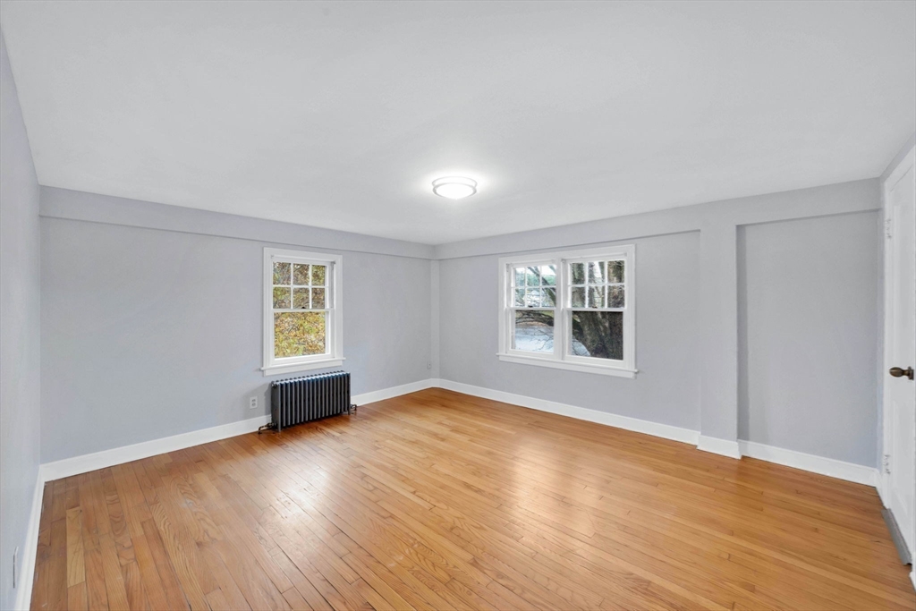 4 Leonard Road Stafford, CT 06076 - Photo 24 of 37 a view of an empty room with wooden floor and a window
