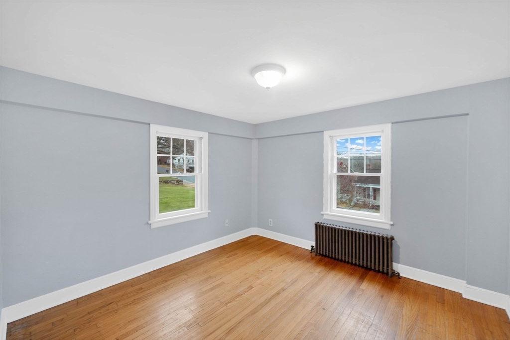 4 Leonard Road Stafford, CT 06076 - Photo 25 of 37 an empty room with wooden floor and windows