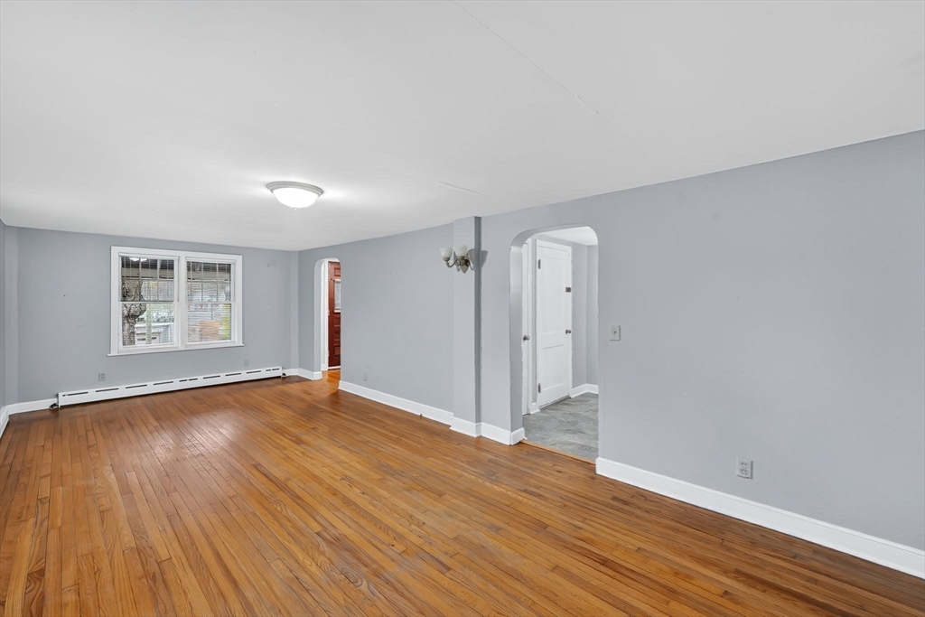 4 Leonard Road Stafford, CT 06076 - Photo 27 of 37 a view of an empty room with wooden floor and a window