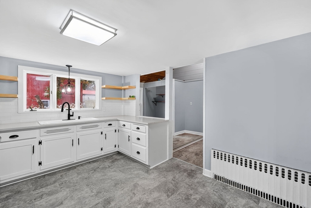 4 Leonard Road Stafford, CT 06076 - Photo 7 of 37 a spacious bathroom with mirror and sink