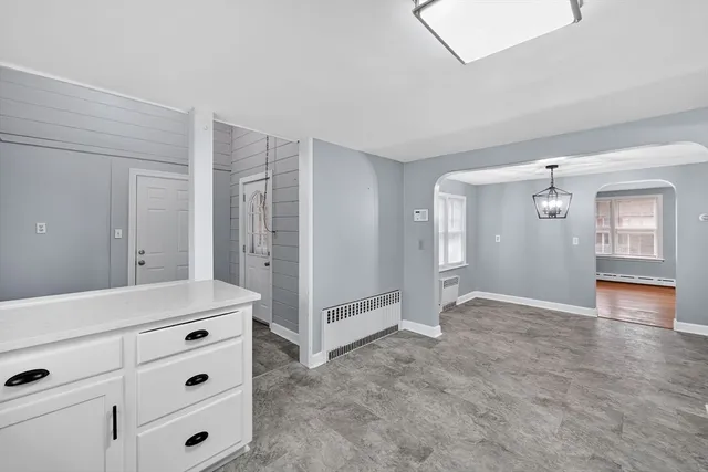a kitchen with stainless steel appliances a refrigerator sink and cabinets