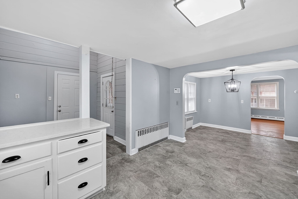 4 Leonard Road Stafford, CT 06076 - Photo 8 of 37 an empty room with cabinet and wooden floor