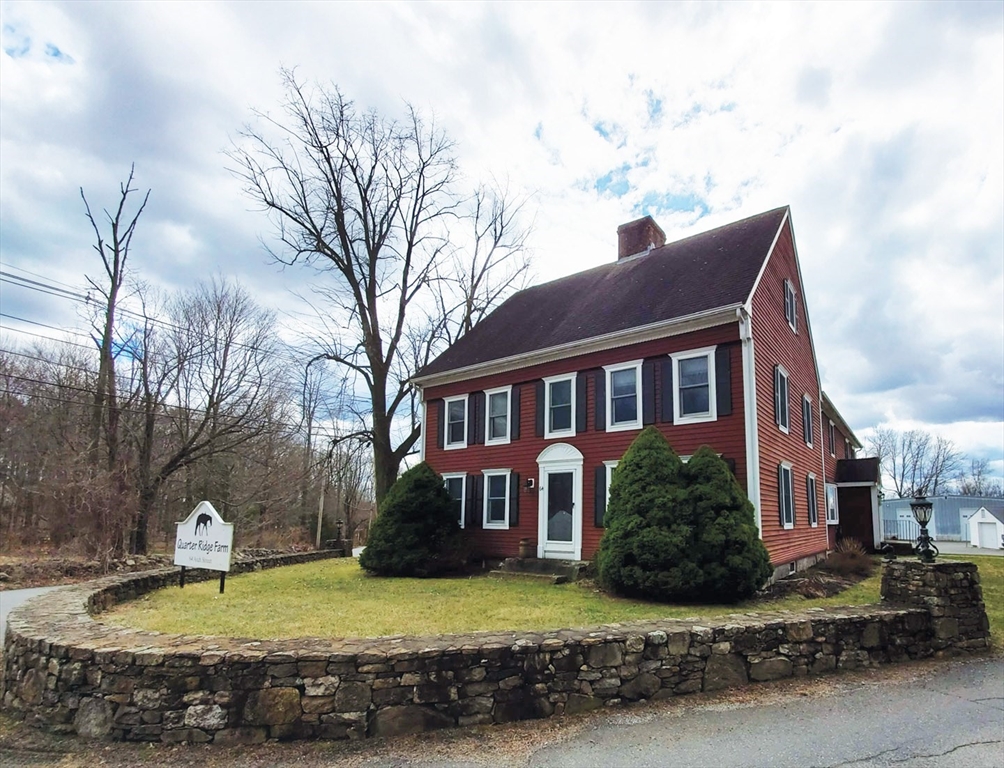 64 Arch Street Westborough, MA 01581 - Photo 1 of 42 a view of a house with a yard covered in snow