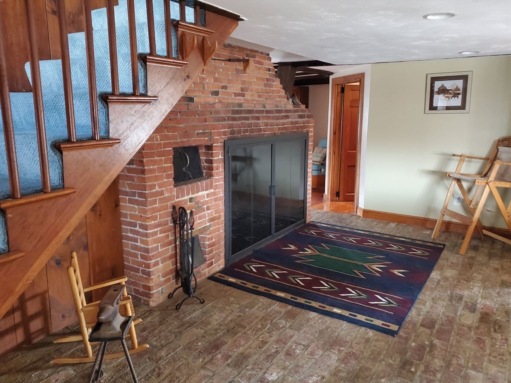 64 Arch Street Westborough, MA 01581 - Photo 15 of 42 a living room with chairs and a rug
