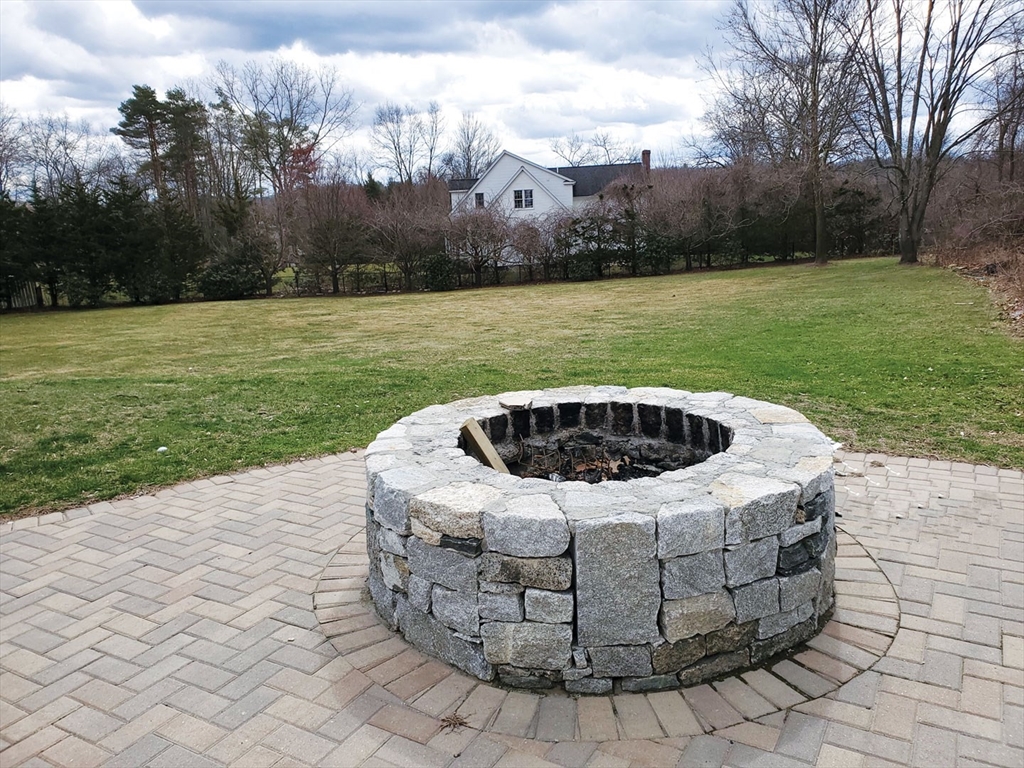 64 Arch Street Westborough, MA 01581 - Photo 25 of 42 a view of a swimming pool with a yard
