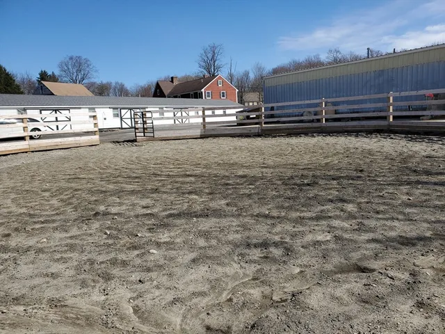 a bed room with bed and umbrellas