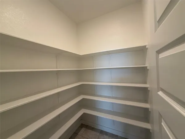 a storage room with wooden floor