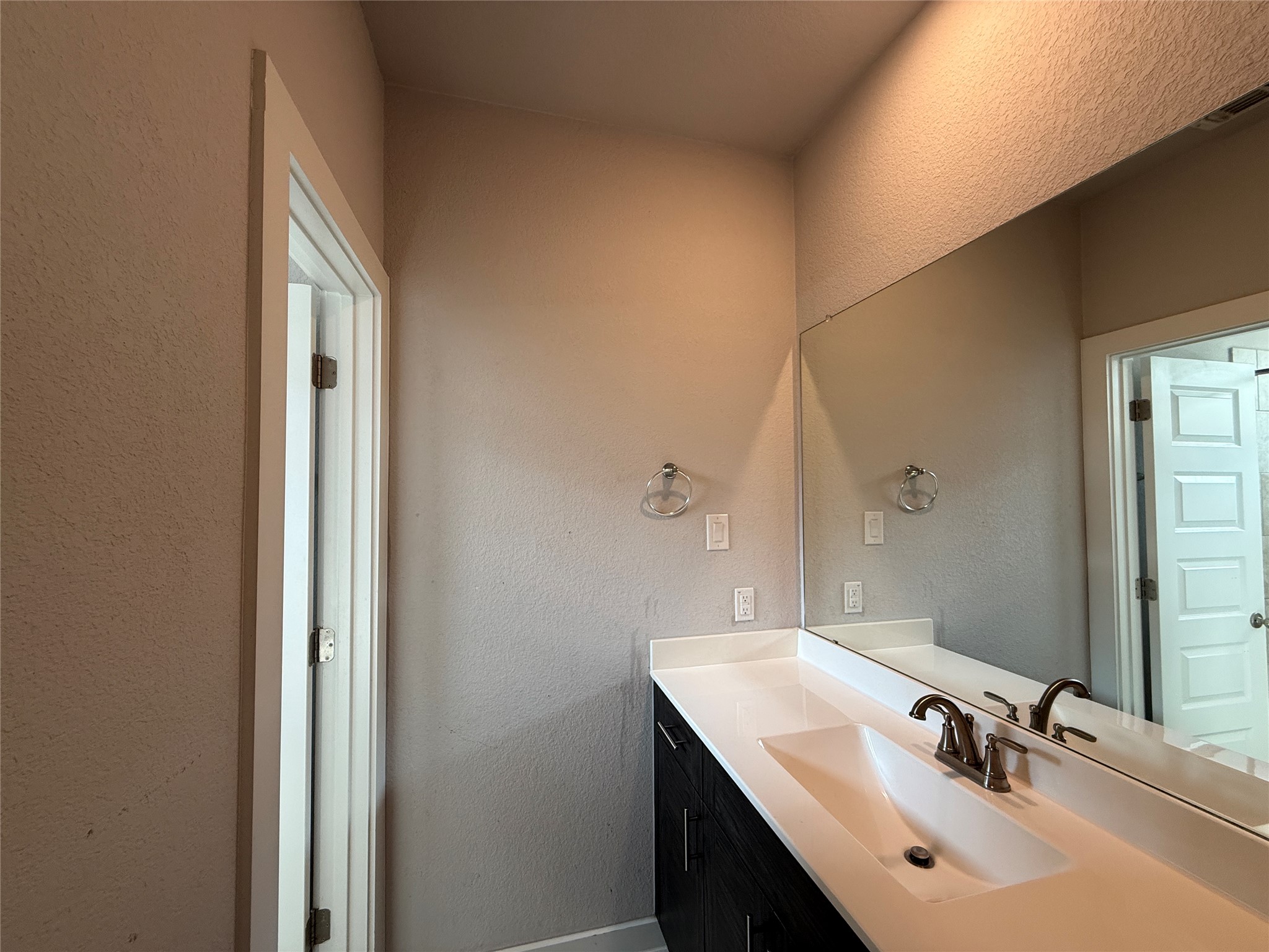 18300 Emu Lane Manor, TX 78653 - Photo 20 of 35 a bathroom with a sink and a mirror