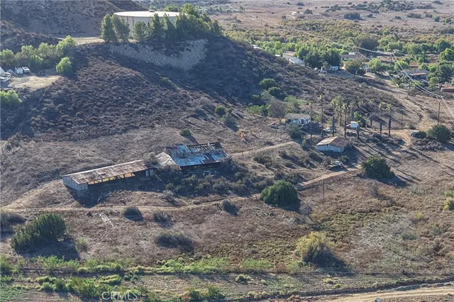a view of a house with a yard and mountain