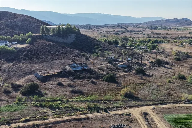 a view of a chairs and table in the patio