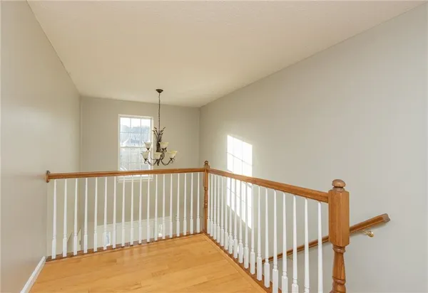 a view of a hallway with windows