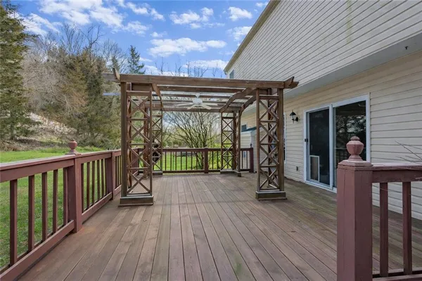 a view of a porch with wooden floor