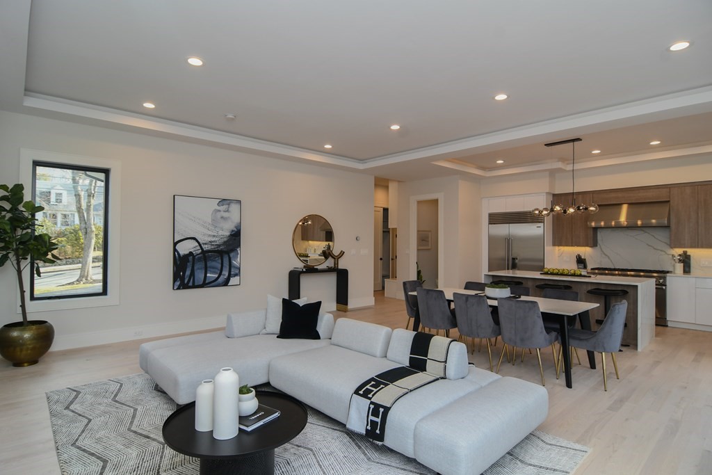 33 Cragmore Road Newton, MA 02464 - Photo 2 of 6 a living room with furniture and view of kitchen