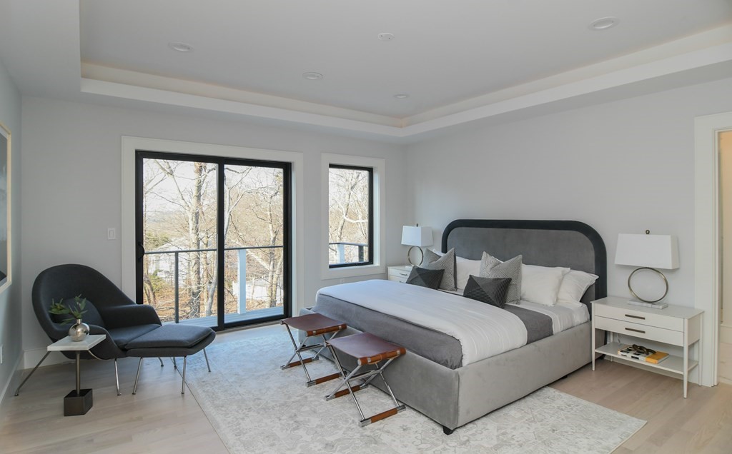 33 Cragmore Road Newton, MA 02464 - Photo 5 of 6 a bedroom with a bed a table and chair