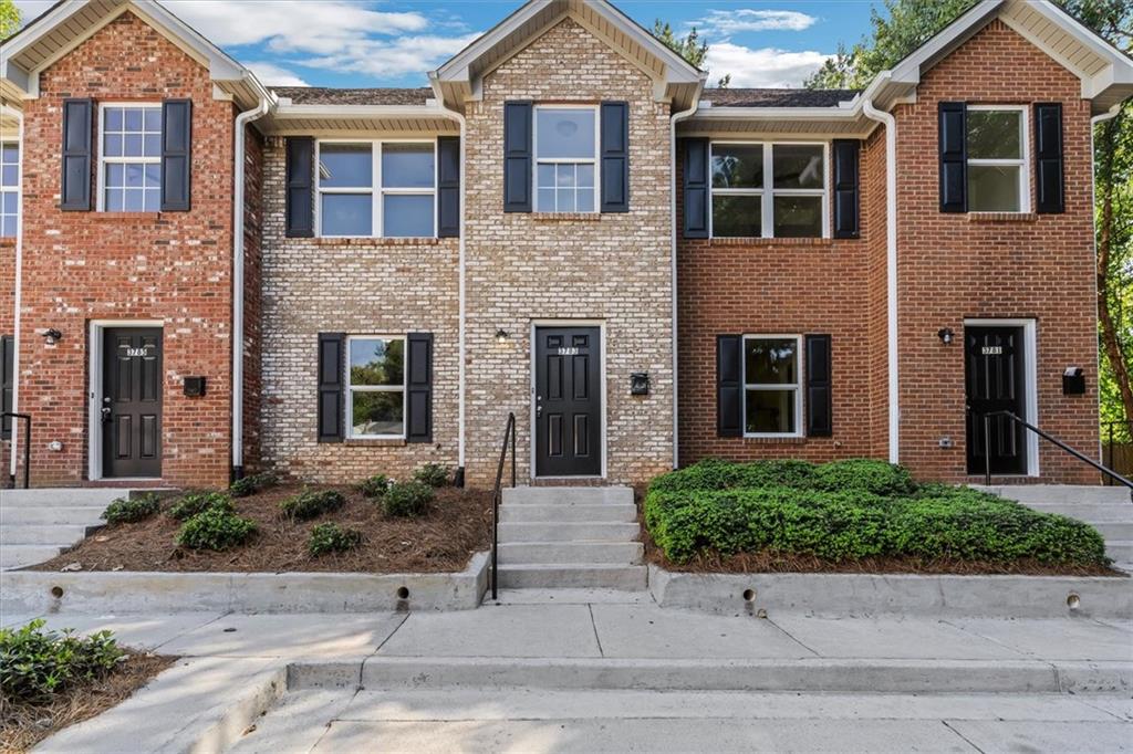 3781 Travis Trace Decatur, GA 30032 - Photo 1 of 1 a front view of a house with yard