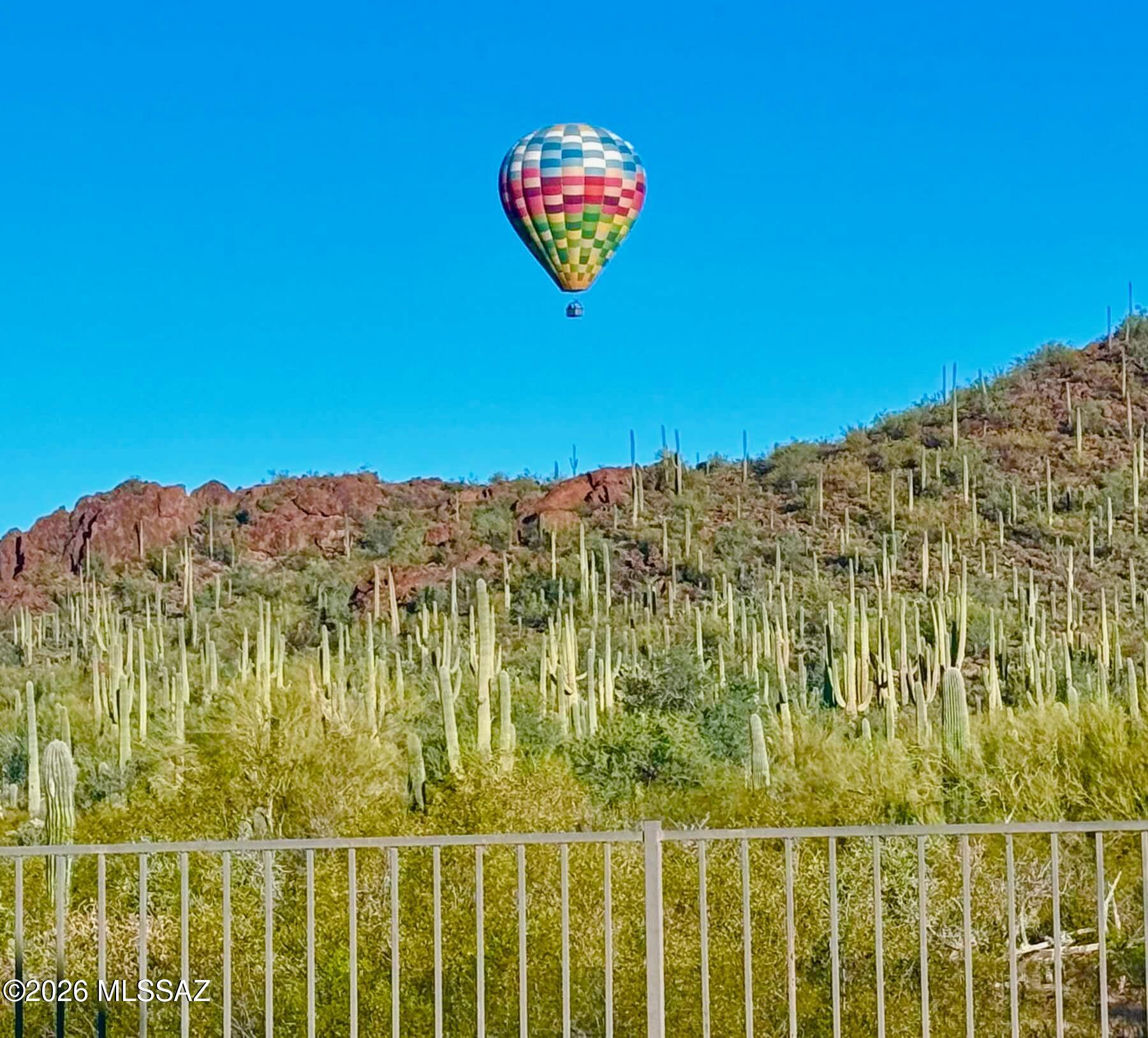 8489 North Lone Ranger Road Tucson, AZ 85743 - Photo 44 of 50 Mornings with hot air balloons floating against the Sonoran Desert sunrise.