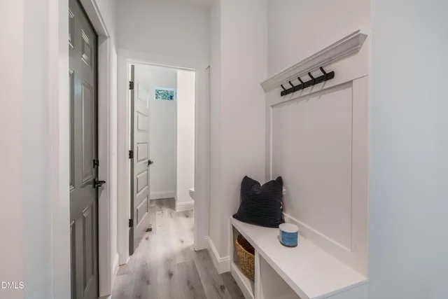 an empty room with a window and a ceiling fan